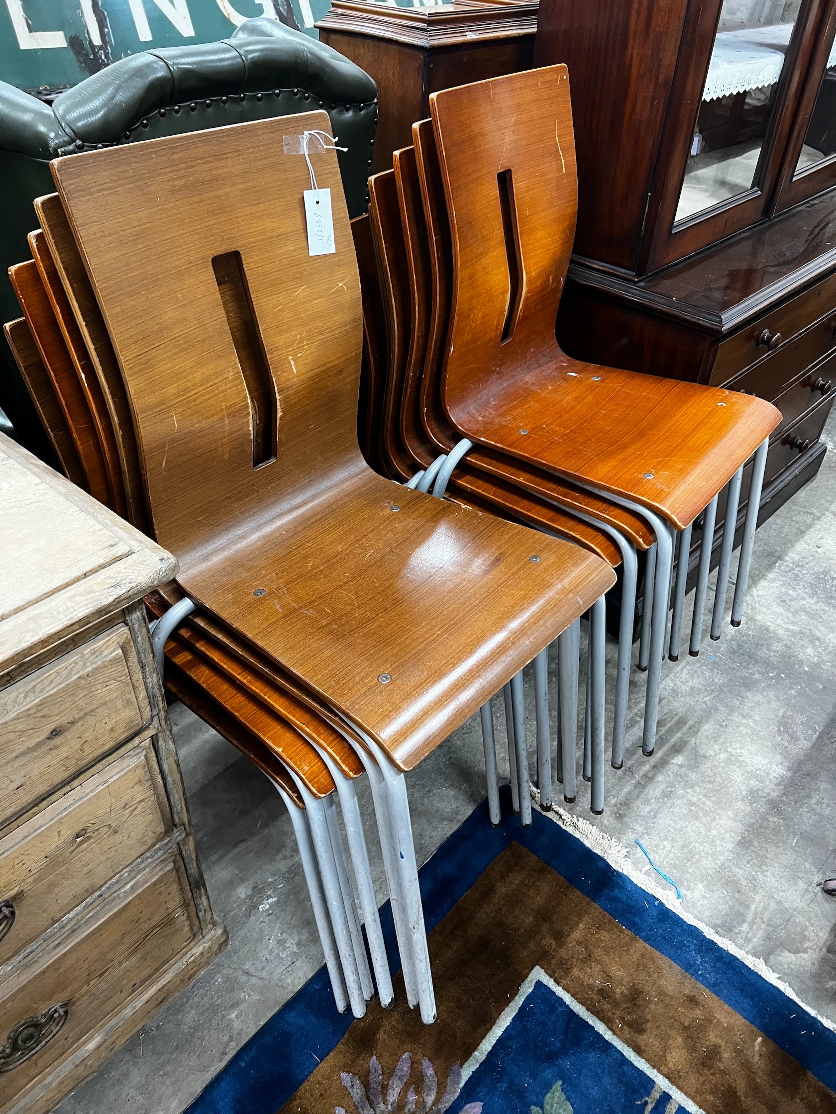 A set of twelve bent plywood stacking chairs